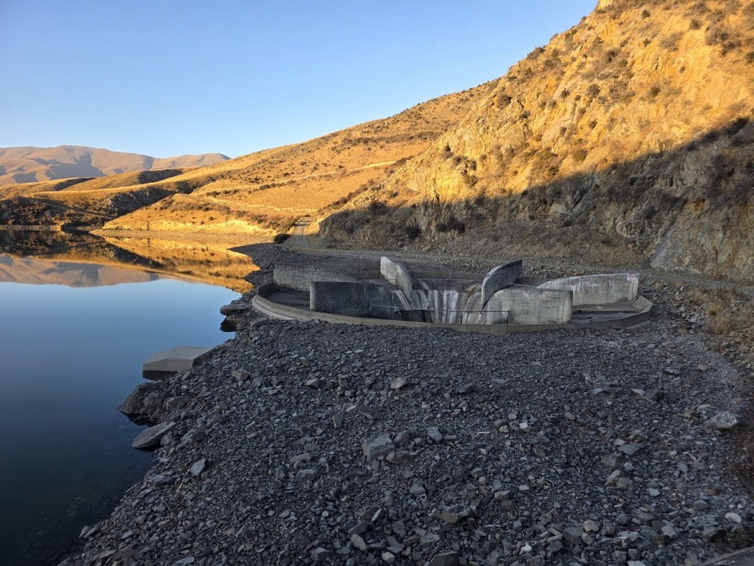 Falls Dam Redevelopment — concrete outlet structure at the reservoir edge
